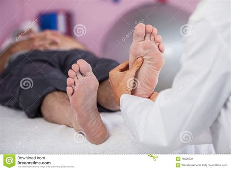 Senior Man Receiving Foot Massage From Physiotherapist Stock Image Image Of Massaging