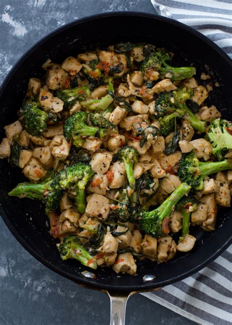 This cheesy chicken broccoli casserole is a simple and delicious dinner filled with chicken, broccoli and cheese and topped with buttered bread crumbs! 15 Minute Keto Garlic Chicken with Broccoli and Spinach | Gimme Delicious