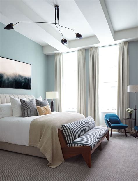 A dark gray canopy bed sits in this bedroom. Tribeca Citizen | Loft Peeping: Sterling Mason Bachelor Pad