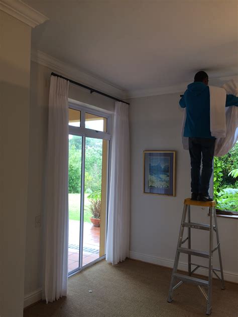 For anyone who lives in a space that may frown upon making holes in the walls, or for anyone who may not want to take on such a task, there's a simple alternative to hanging curtains or drapes. Installing Curtains - Carol's Curtains
