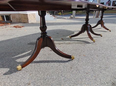 Square dining tables are popular and efficient tables that range in size from two to twelve person seating options. Solid Mahogany Regency Dining Table of Narrow Width at 1stdibs