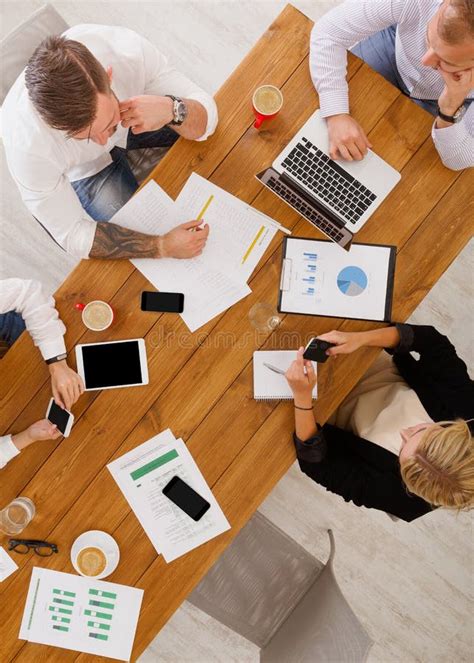 Group Of Busy Business People Meeting In Office Top View Stock Image