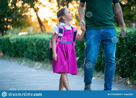 First Day At School Father Leads A Little Child School Girl In First