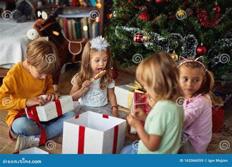 Cute Children Opening Christmas T At Home Stock Image Image Of