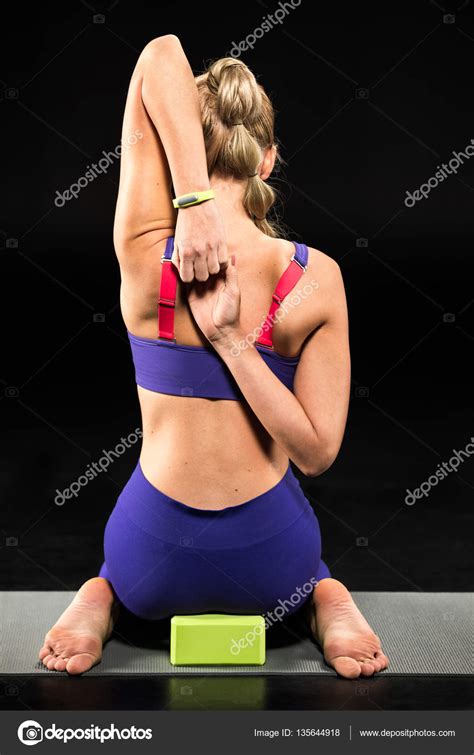 Athletic Woman Stretching Stock Photo OlgaZakrevskaya 135644918