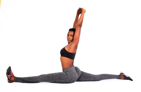 Flexible Woman Doing Forward Splits Yoga Pose