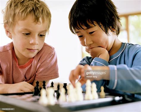 Two Boys Playing Chess Closeup High Res Stock Photo Getty Images