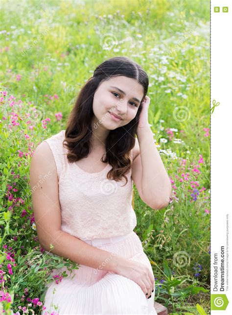 Pretty Girl Sits On Richly Meadow Stock Photo Image Of