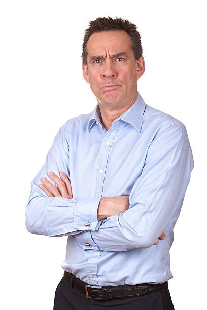 Royalty Free Angry Frowning Grumpy Middle Age Man With Arms Folded