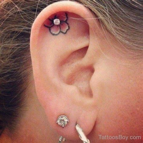 Nice Flower Tattoo On Ear Piercing Tattoo Piercing Jewelry Body Jewelry Cartilage Piercing