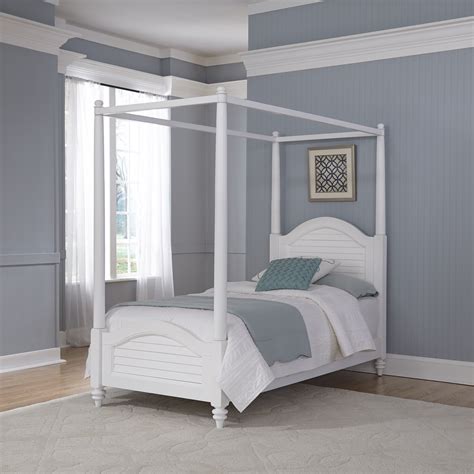 Think velvet and leather upholstery for a cultivated vibe, or go with wood and woven suede for a more relaxed aura. Home Styles Bermuda Brushed White Twin Canopy Bed