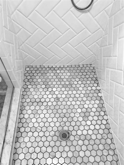 I'm thinking tiny carrara marble tiles to complement the vanity countertop, but i'm not sure. Bathroom floor tile. Herringbone beveled white subway tile ...