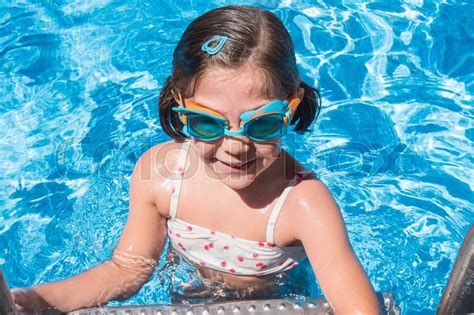 Smiling Girl Enjoying The Pool In Stock Image Colourbox