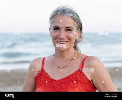 Happy Retired Senior Woman With Gray Hair At Beach Stock Photo Alamy