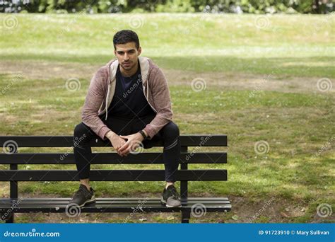 Fit Young Man Sitting On Bench In Park Stock Photo Image Of Looking