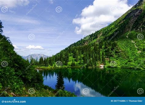Wonderful Mountain Lake With Waves In A Green Landscape Stock Photo