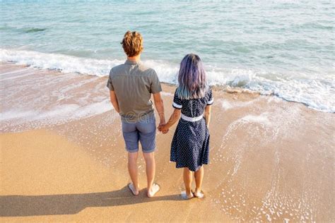 Rear View Of A Couple Standing On The Sea Shore Stock Image Image Of