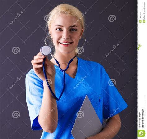 Female Doctor With A Stethoscope Listening Isolated On Gray Background
