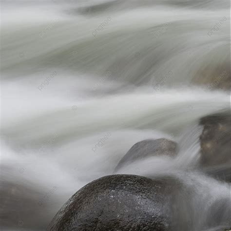 View Of Fast Moving Water Over Rocks In River Background Long Stream