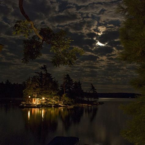 A Beautiful Cottage At Night On A Lake Pics
