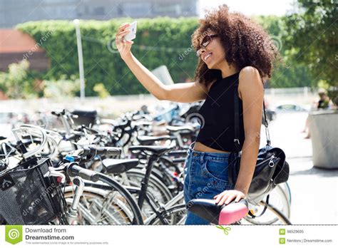 Beautiful Young Woman Taking A Selfie In The Street Stock Image