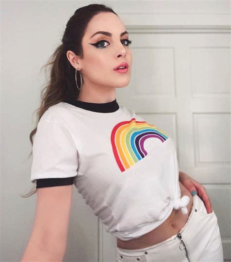 A Woman In White Shirt With Rainbow On It