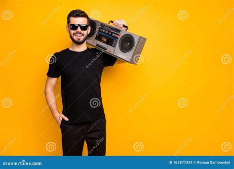 Portrait Of Cool Charming Positive Guy Hold Boom Box On His Shoulder