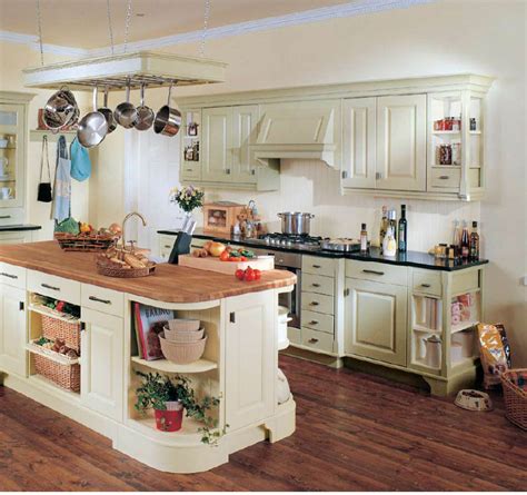 Country galley kitchen in sydney with an undermount sink, shaker cabinets, white cabinets, white splashback, subway tile splashback, stainless steel appliances, medium hardwood floors, with island, brown floor and white benchtop. Modern Furniture: Country Style Kitchens 2013 Decorating Ideas