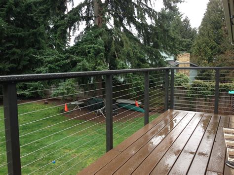 The 1/8 thick cable allows any deck, patio or stairway to be an unobstructed. Image result for decking with metal post and wire balustrade images | Cable railing, Wire deck ...