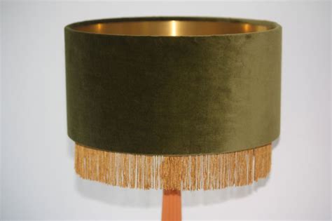 Shop our lamp shade range including large lamp shades, drum lamp shades, bedside lamp shades, table lamp shades and much more. Olive Green Velvet shade with Gold fringe trim and brushed ...