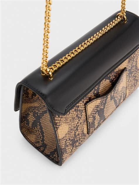 Charles And Keith Clutch Bag Online Sale Snake Print Metallic Accent