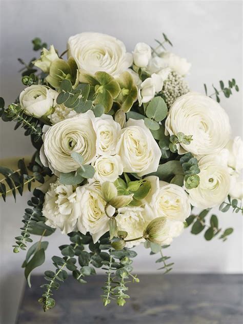 Shades of cream, ivory, and blush can shade white flower petals. White & Green Seasonal Mix | Banksia Florist