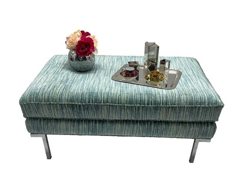 The table is fixed in size but has 2 main material. Early 21st Century Theatre Ottoman/Coffee Table by Ted Boerner for DWR For Sale at 1stDibs