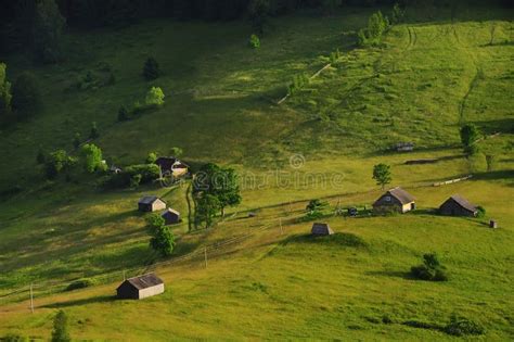 Rural Houses Are High In The Mountains On Green Meadows Stock Image
