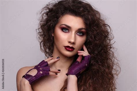 Sexy Curly Beauty Girl With Purple Lips Provocative Make Up Luxury Woman With Blue Eyes