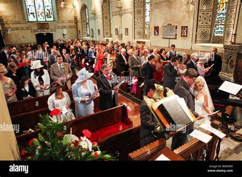Traditional Uk Church Wedding Ceremony Bride And Groom At Altar