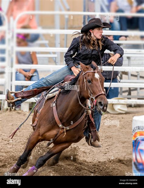 Cowgirl On Horseback Riding In The Ladies Barrel Racing Event Chaffee