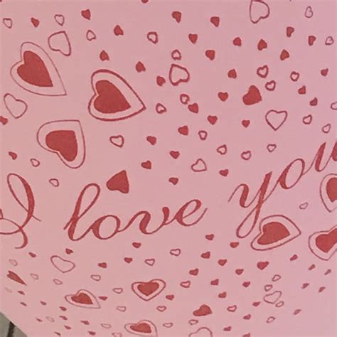 A Pink Balloon With Hearts And The Words I Love You On Its Side
