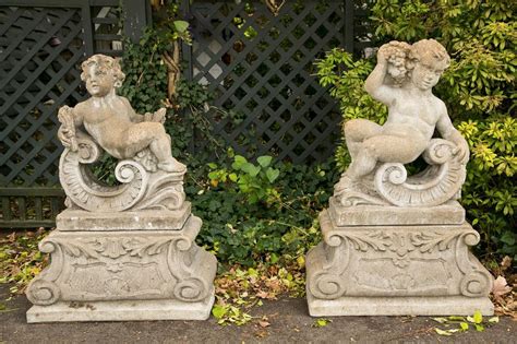 Pair Of Classical Stone Composite Putti Garden Statues Holding Wheat