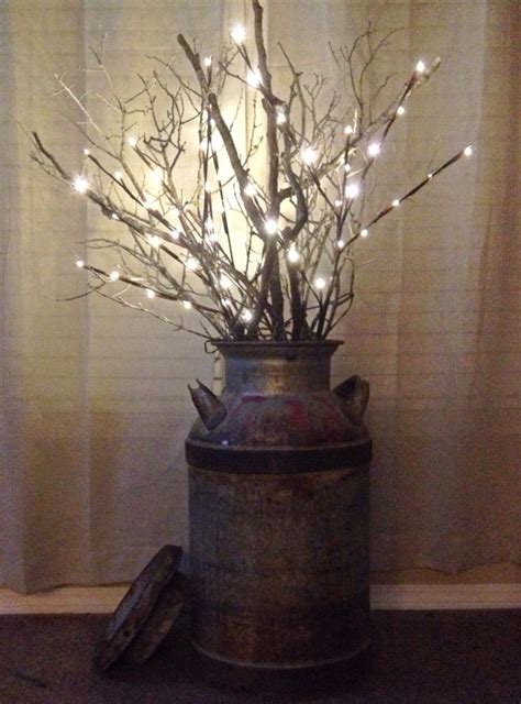Decorate with candles this fall to create ambience and mood. LED branch lights and a few real branches in an old milk ...