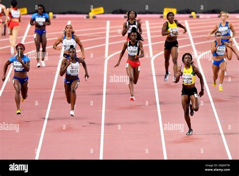 shericka jackson of jamaica foreground right runs to win the women s 4x100 meter relay final
