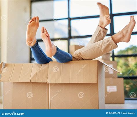 Handle With Care Shot Of An Unidentifiable Young Couple Lying In A Box Together With Their Feet