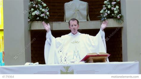 Catholic Priest Reads Prayer From The Bible During Stock Video Footage