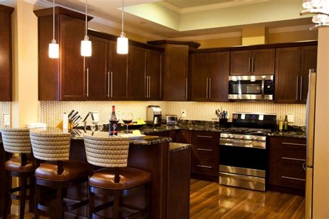 Kitchen cabinets backsplashes remodeling islands and storage using the mahogany tone or darker tones for the cabinet finish. Cute Dark Brown Color Mahogany Wood Kitchen Cabinets comes ...