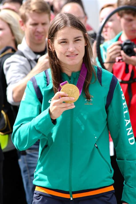 irish boxer katie taylor shows off her olympic gold medal at dublin airport teamireland