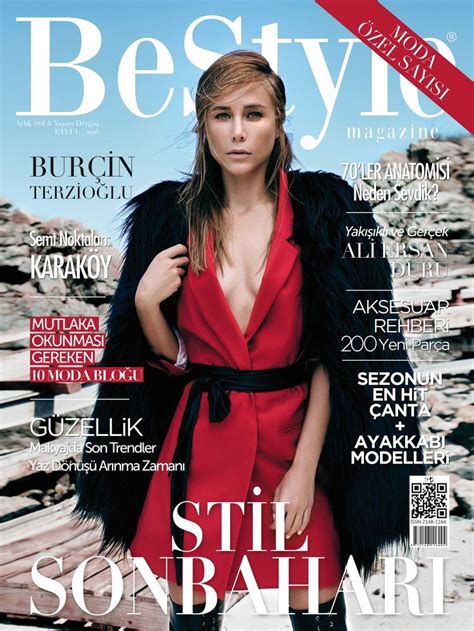 a woman in a red dress and black fur coat on the cover of a magazine