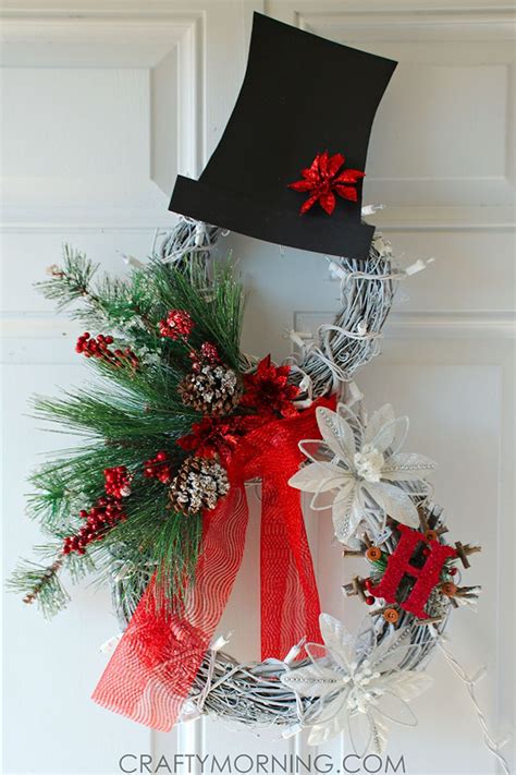 A Christmas Wreath With Red Bows And Pine Cones On The Front Door Is