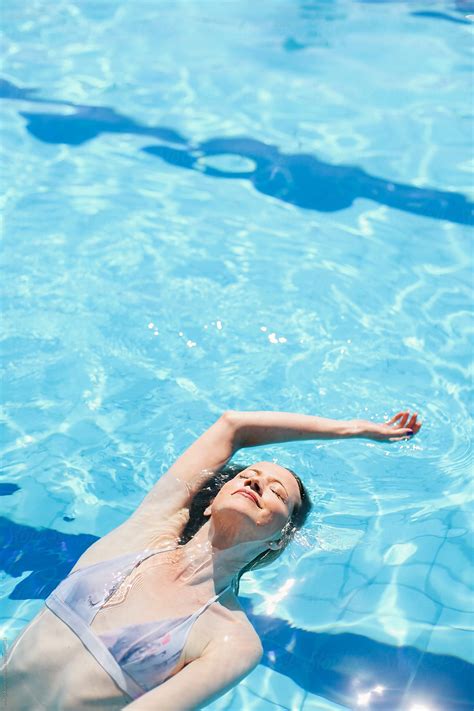 Woman Swimming By Stocksy Contributor Marija Kovac Stocksy