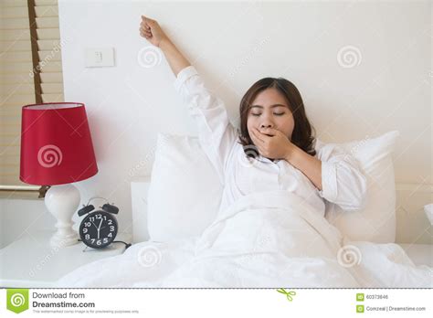 Sleepy Asian Woman Yawning In Bed Stock Photo Image Of Person Female