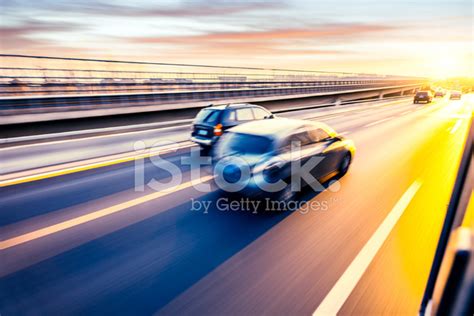 Car Driving On Freeway At Sunset Motion Blur Stock Photo Royalty